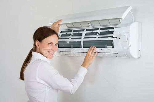 商业照片: 女实业家 · 冷气机 · 年轻 ·墙· 办公室 · 业务